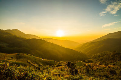 Scenic view of mountains against sky during sunset