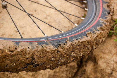 Bicycle wheel with dirt on the tire. concept of safeness or overcoming difficulties.