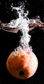 Close-up of splashing water against black background