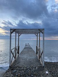 Pier over sea against sky