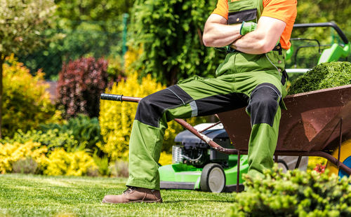 Low section of man working at park