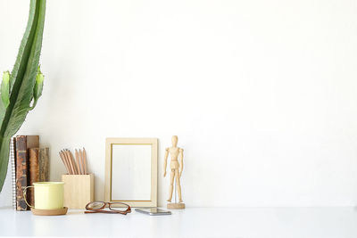 Close-up of objects on table against white background