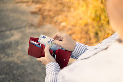 Midsection of woman holding gift