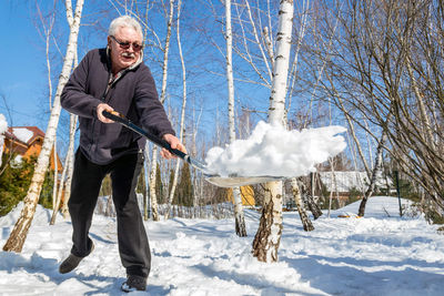 Man standing on snow covered landscape