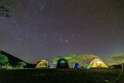 Low angle view of tent against sky at night