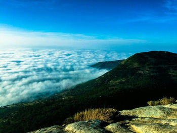 Scenic view of landscape against cloudy sky