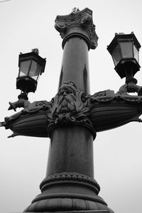 Low angle view of statue against sky in city