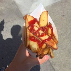 Cropped image of man holding food