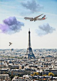 Airplane flying over buildings in city