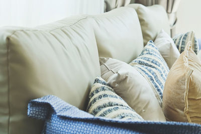 Close-up of cushions on sofa at home