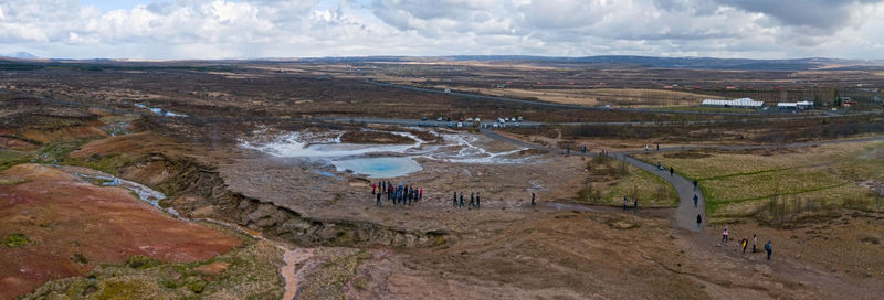 High angle view of people on land against sky