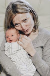 Portrait of mother and daughter at home