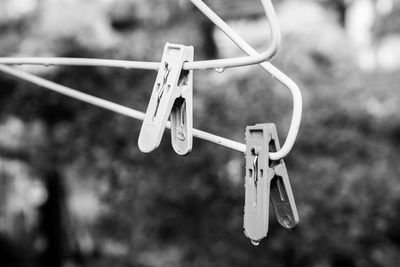 Close-up of clothespins on clothesline