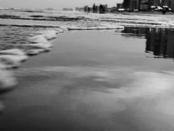 Reflection of sky on puddle