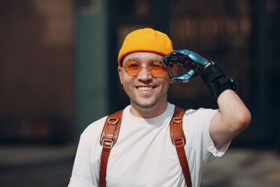 Portrait of man holding camera