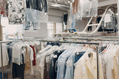 Close-up of clothes hanging in store