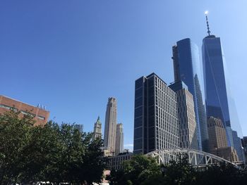 Low angle view of buildings against blue sky