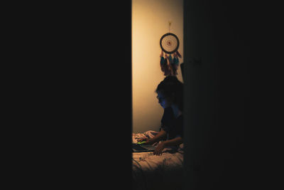 Young girl studying and reading with her computer during lockdown