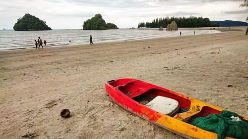 Old kayak at sea shore