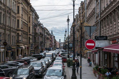 High angle view of cars on road amidst buildings in city