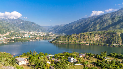Scenic view of lake and mountains against sky