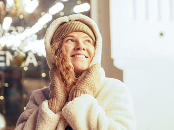 Portrait of young woman wearing hat