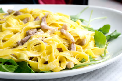 Close-up of fresh carbonara pasta served in plate