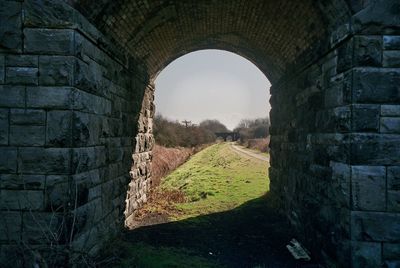 Stone wall against sky