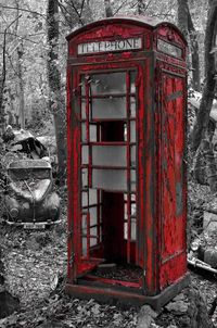 Red telephone booth on wall