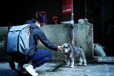 Full length of man with dog