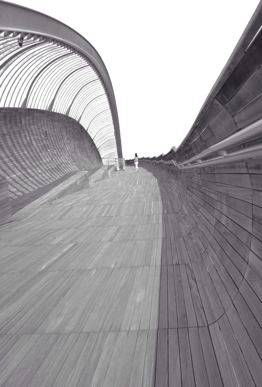 the way forward, diminishing perspective, clear sky, vanishing point, transportation, built structure, architecture, day, pattern, road, empty, outdoors, no people, tunnel, wood - material, copy space, surface level, arch, sky, long