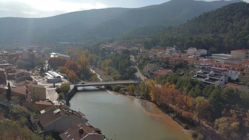 High angle view of river amidst buildings in city