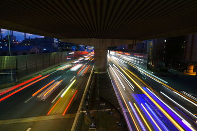 Light trails on road in city at night