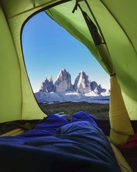 Scenic view of mountains against blue sky