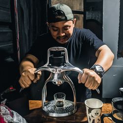 Barista preparing coffee at cafe