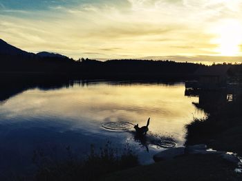 Reflection of clouds in water at sunset