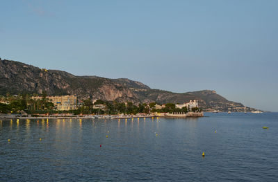 Scenic view of sea against clear blue sky