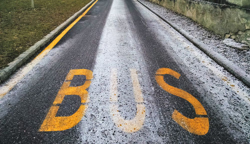 High angle view of snow on bus lane marking