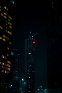 Illuminated buildings in city at night