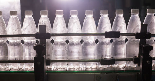 Close-up of bottles in shelf