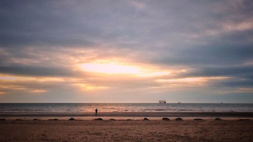 Scenic view of sea against sky at sunset