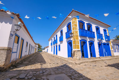 Low angle view of buildings against blue sky