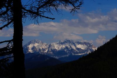 Scenic view of mountains against cloudy sky
