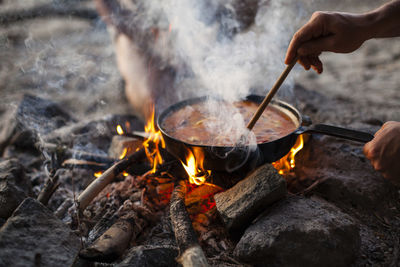 Midsection of man preparing food