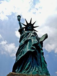 Low angle view of statue against cloudy sky