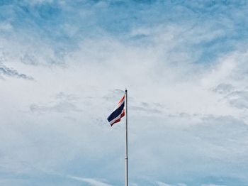 Low angle view of flag against sky