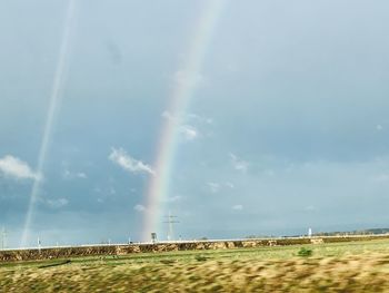 Scenic view of rainbow against sky