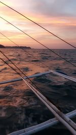 Aerial view of sea against sky during sunset