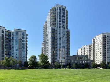 Buildings in city against clear sky