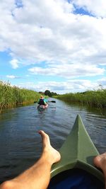 Man surfing on boat against sky